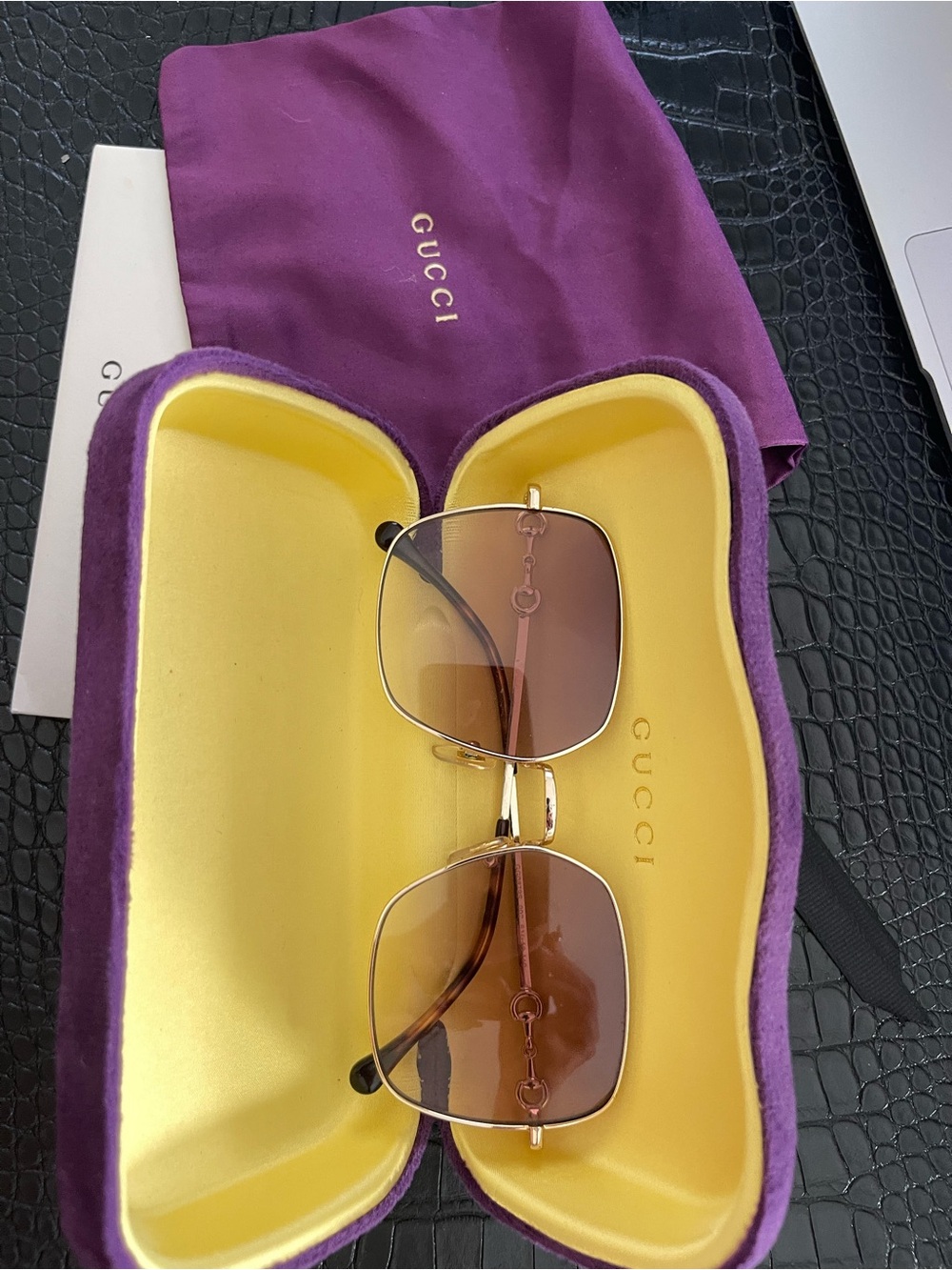 Gucci GG0879S Horsebit oversized sunglasses featuring a gold-tone metal frame